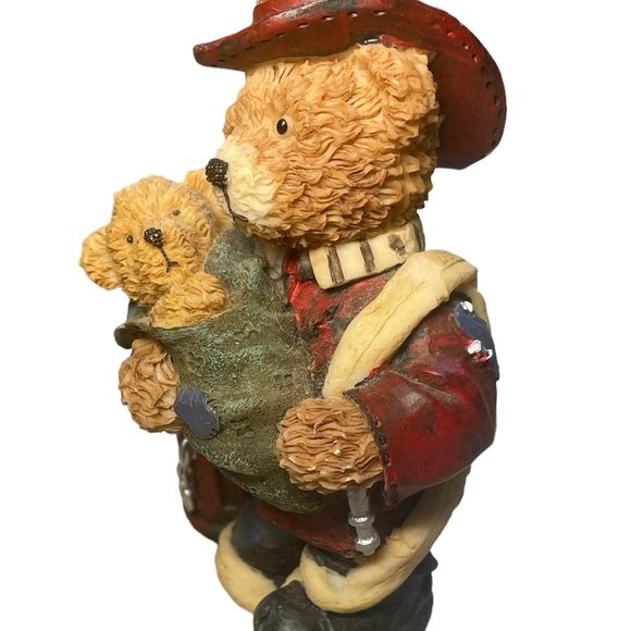 Fireman bear figure holding a baby bear - Picture 4 of 4